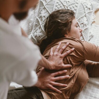 Close-up of a couple enjoying a massage session indoors, highlighting relaxation and therapy.